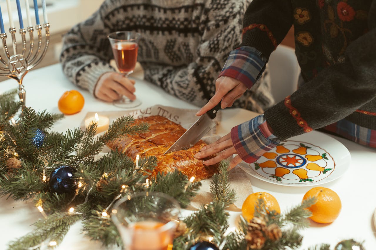 creative-02 Festive Hanukkah table setup with traditional food, menorah, and holiday decor, capturing a warm holiday vibe.